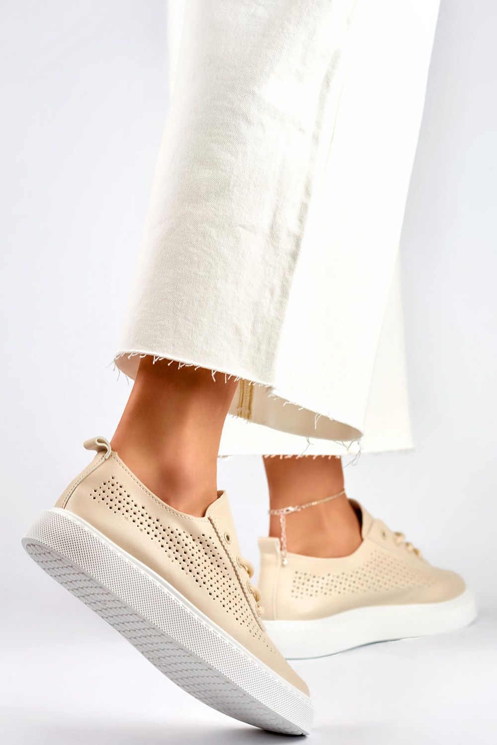 Stylish eco-friendly leather sneakers for women in muted beige, perfect for spring and summer versatility.