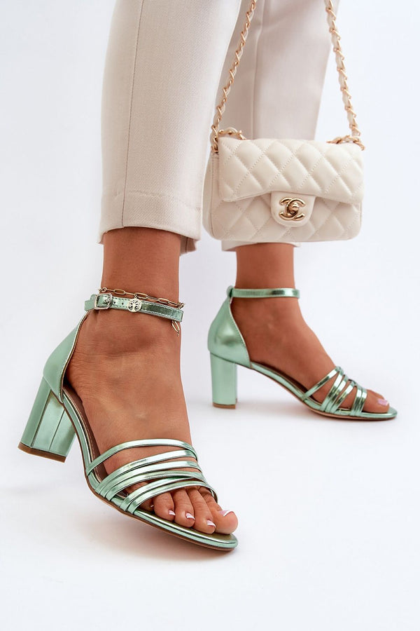 Stylish Eco Leather Heel Sandals for Summer Outfits, featuring a unique heel and charming intertwined straps. Perfect for any occasion.