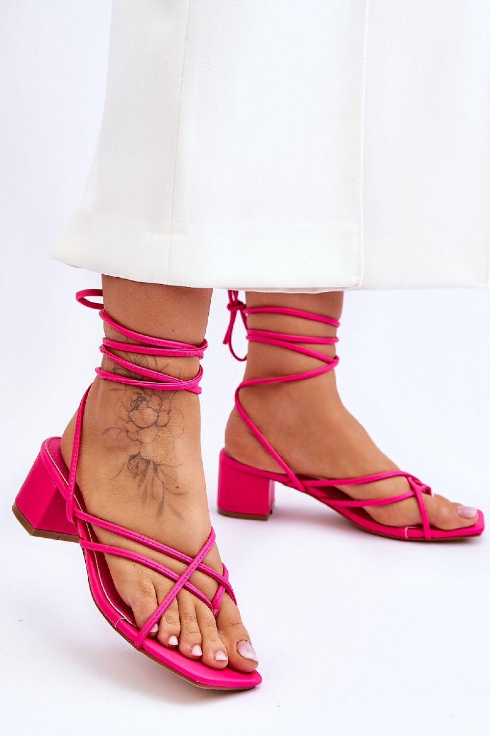 Stylish Strappy Low Heel Sandals for Women in vibrant pink, perfect for comfort and flair this season.