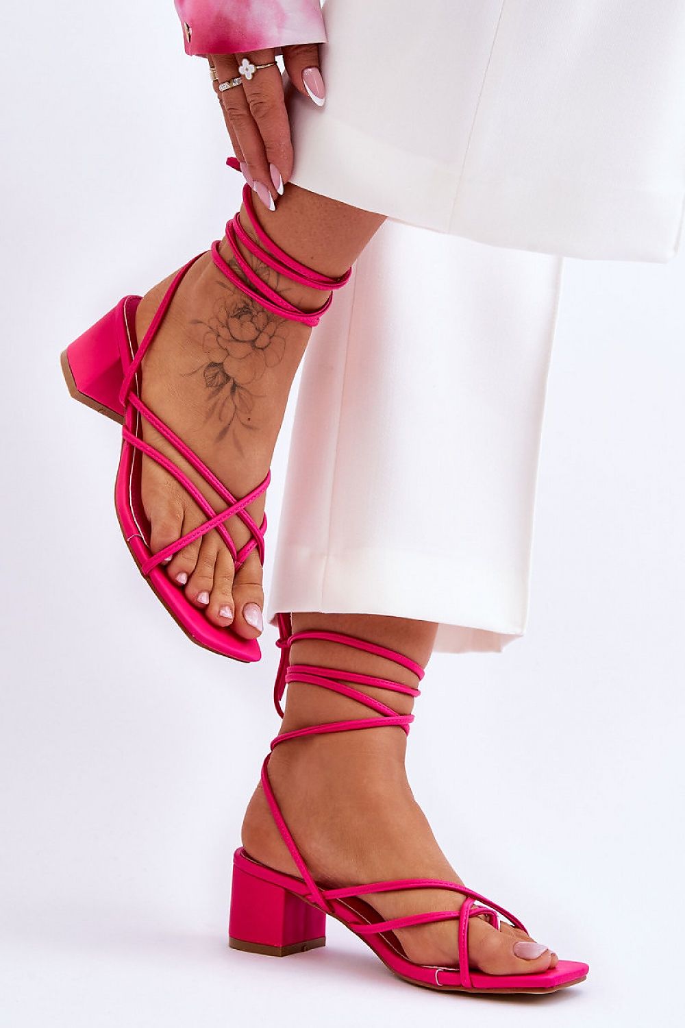 Stylish Strappy Low Heel Sandals for Women in vibrant pink, perfect for airy comfort and head-turning style.