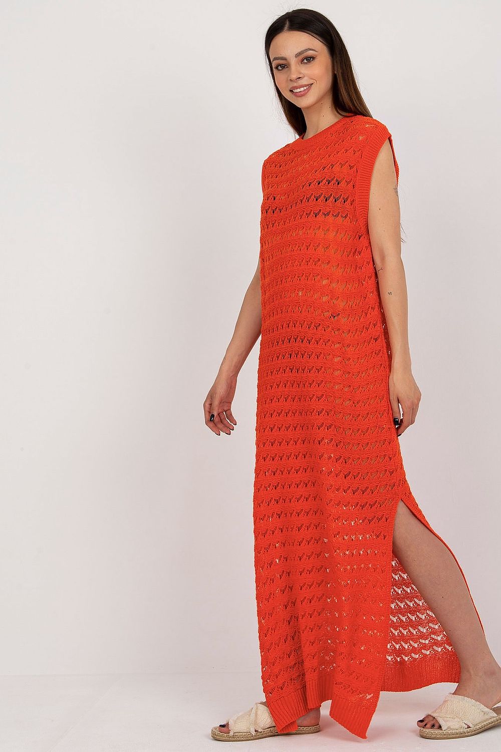 Stylish Openwork Knit Dress perfect for beach days and vacations, showcasing trendy slits and vibrant orange color.